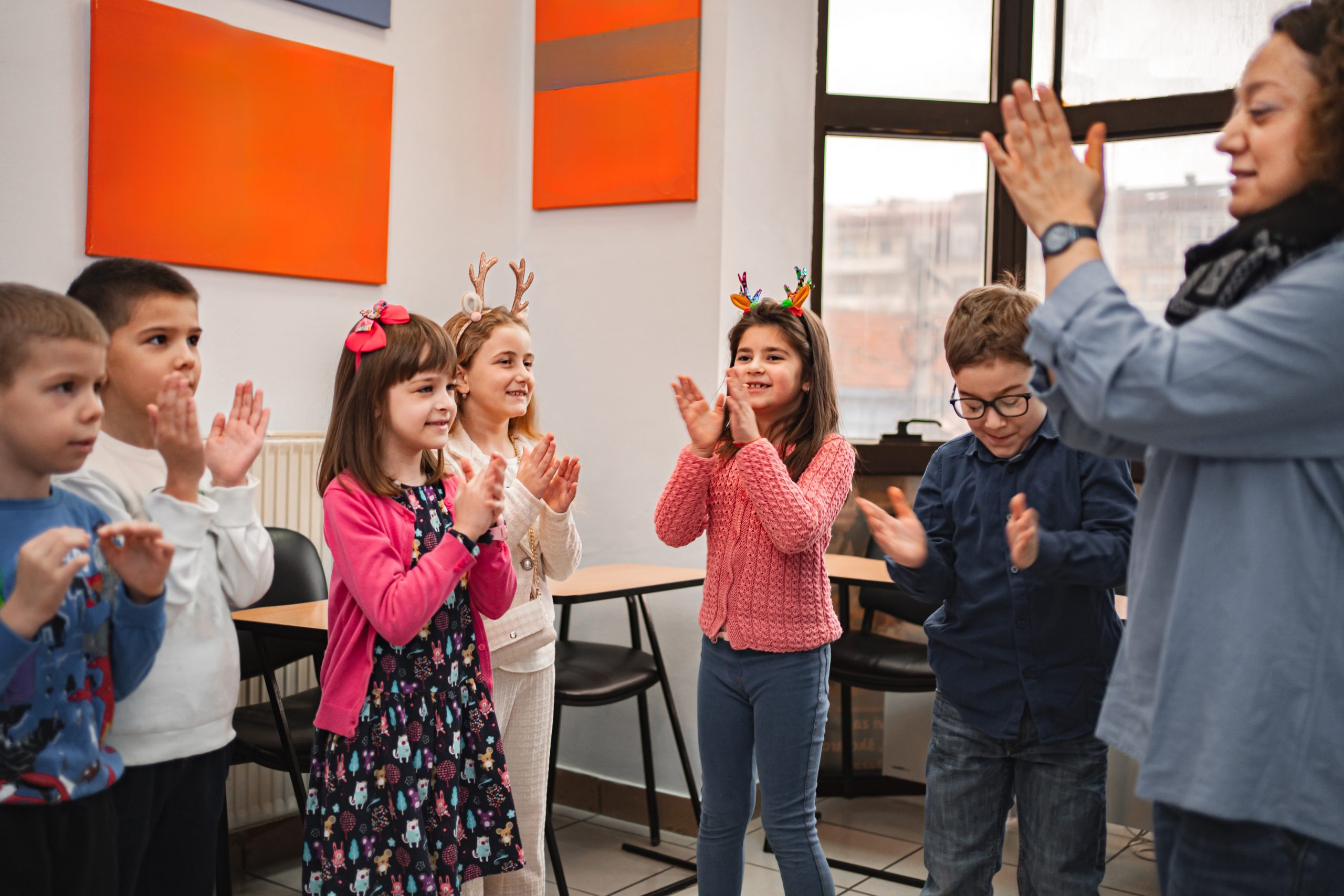 Teacher and elementary students at language school class